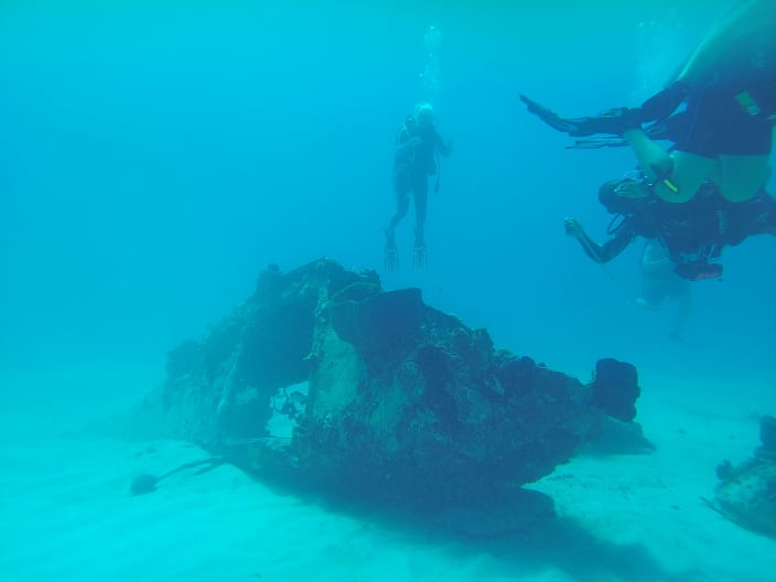 Divers exploring a plane in Jamaica